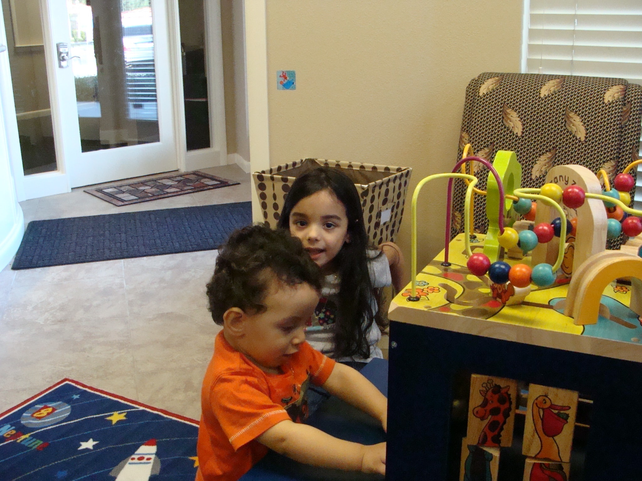 Children playing with activity toys in the waiting area
