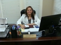 Dr. Attia at her desk in the office