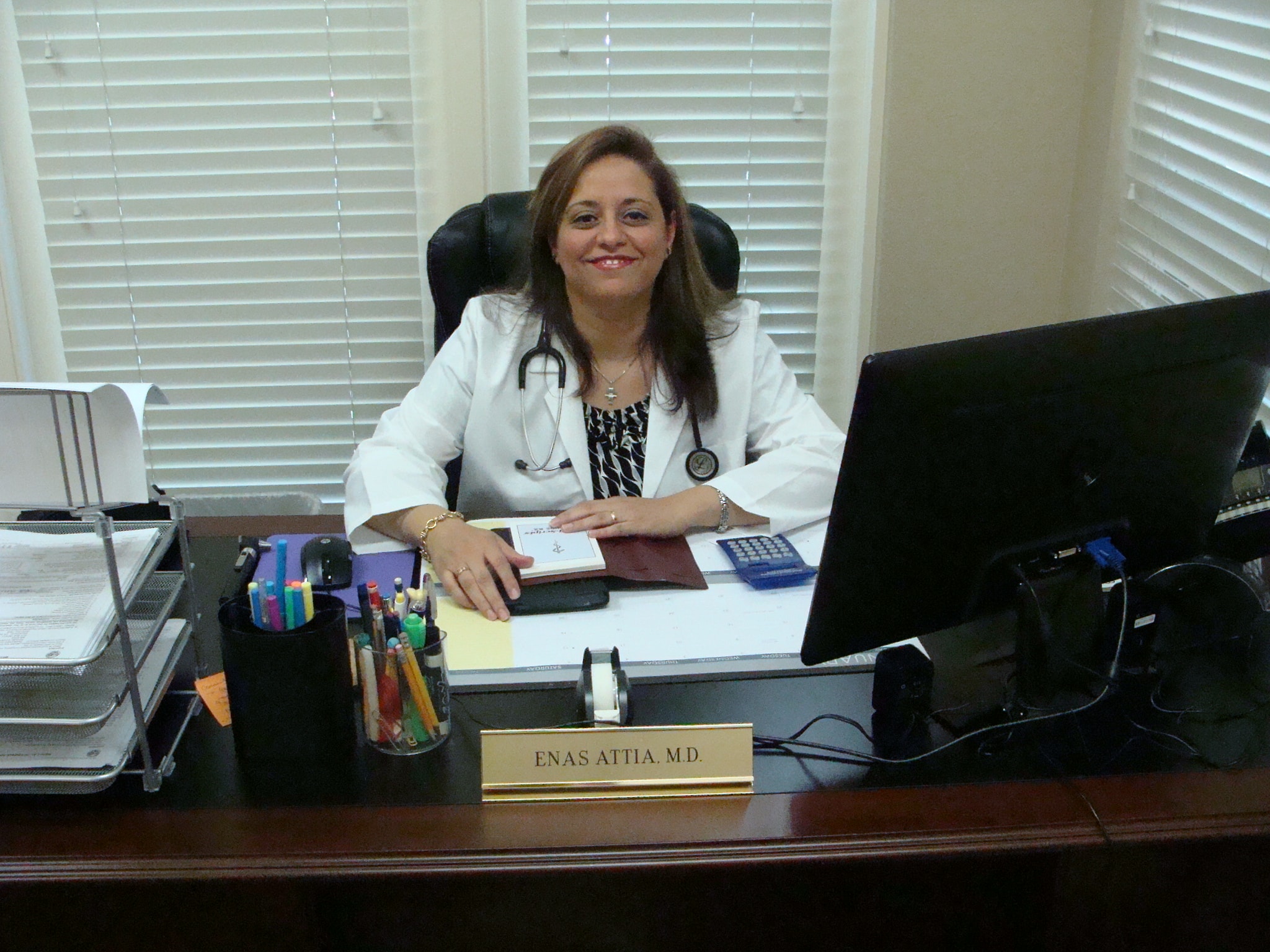 Dr. Attia at her desk in the office